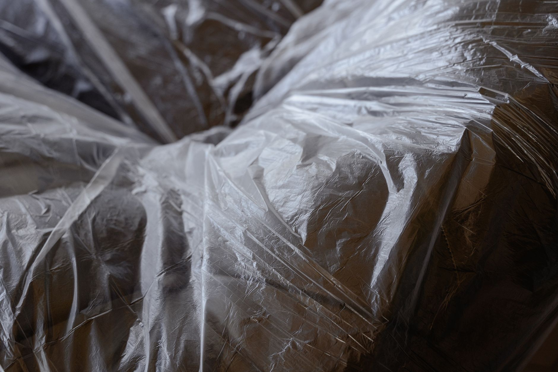 Sofa wrapped and covered for protection during a move