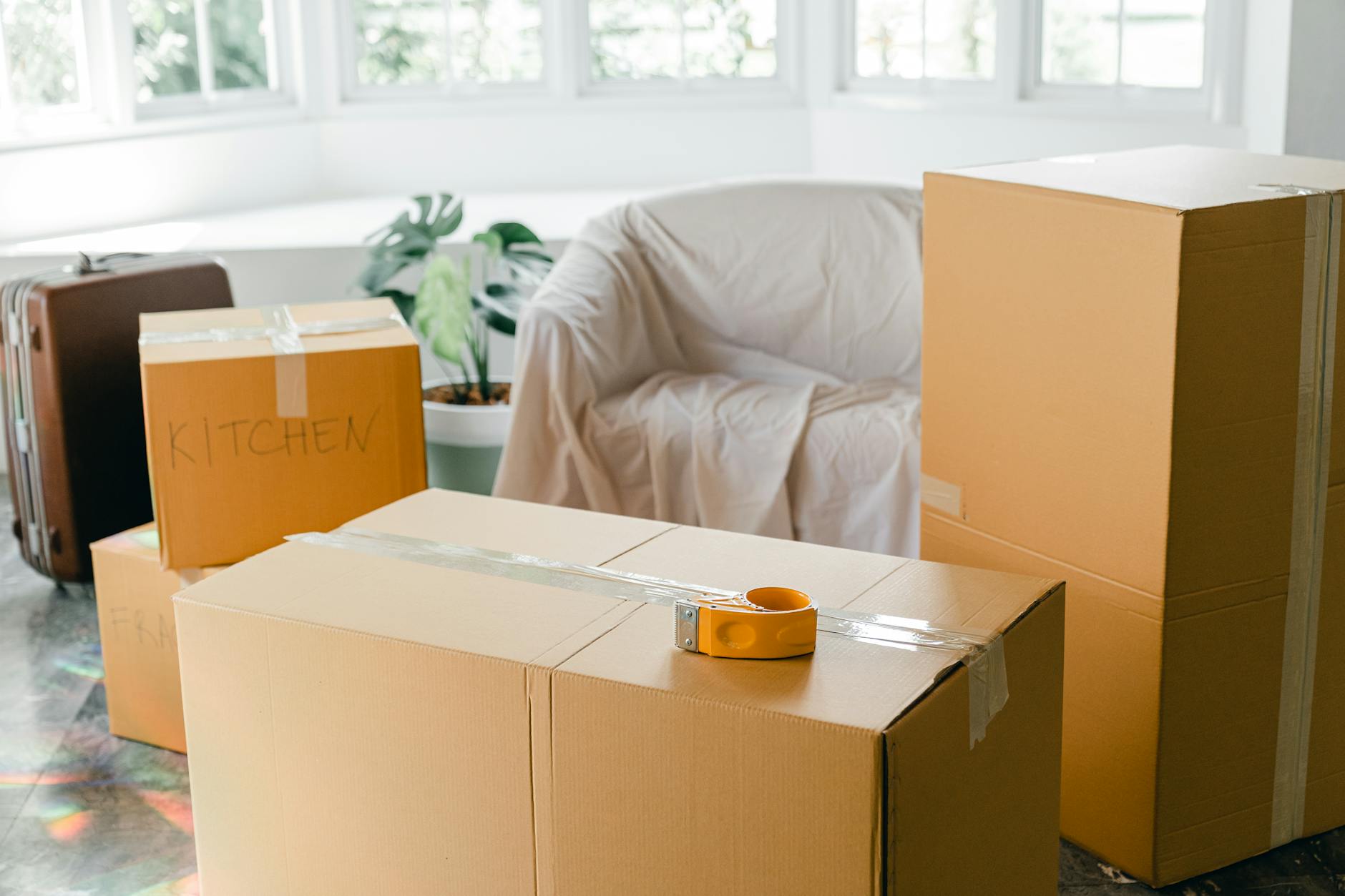 Packed cartons ready in an empty apartment