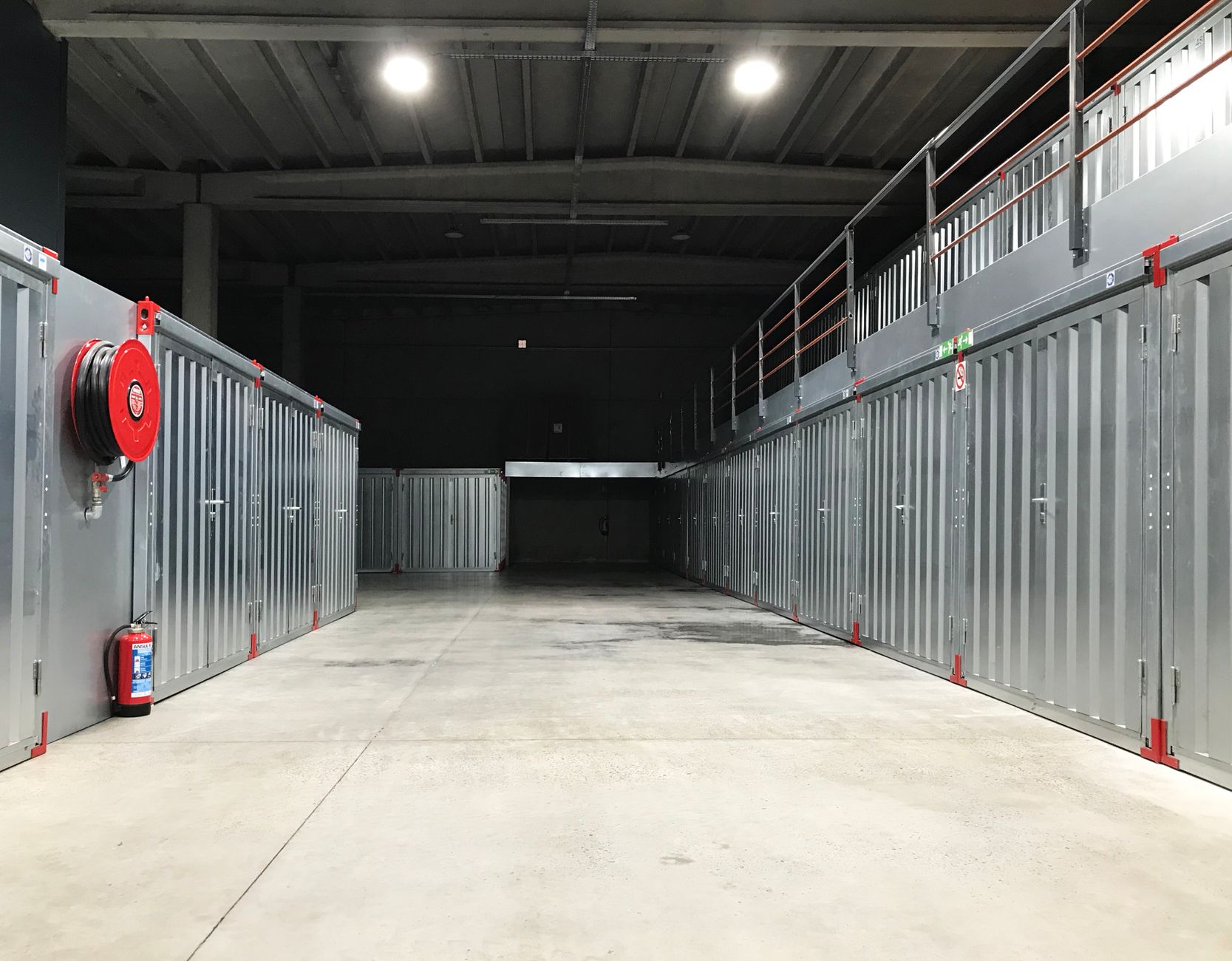 Large indoor storage aisle with multiple unit doors