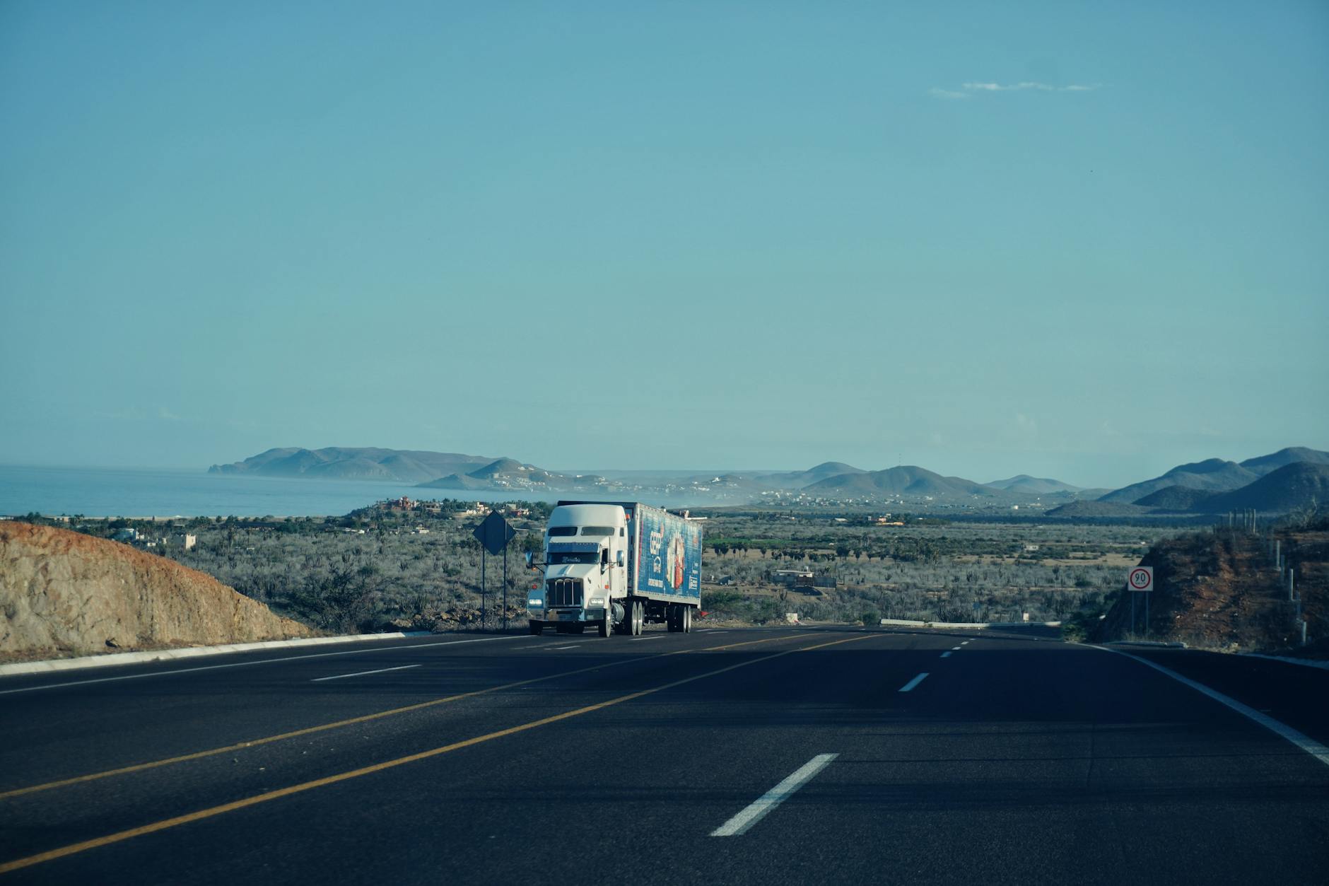 Truck on a scenic highway during a long-distance move